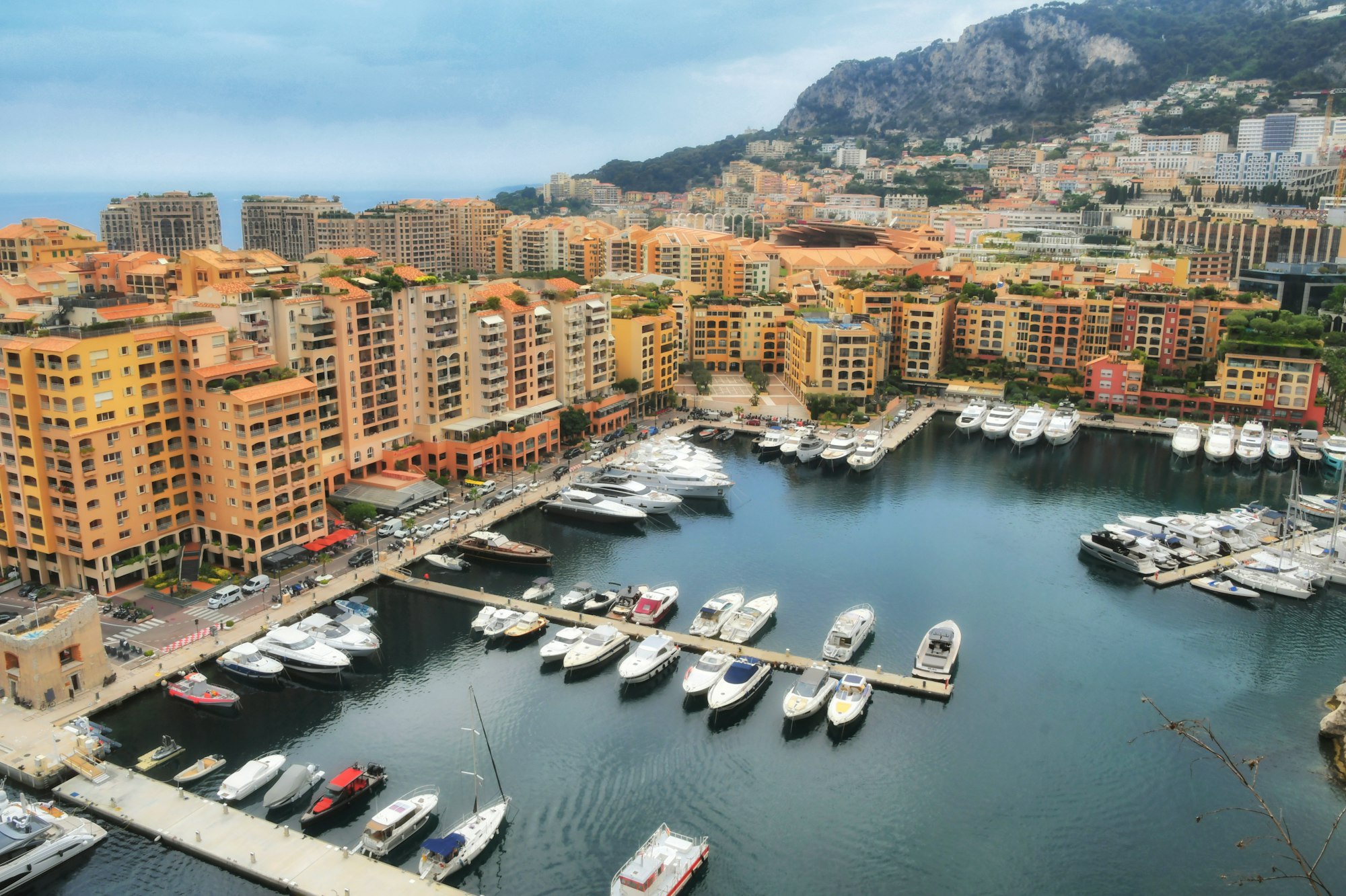Luxury yachts boats in the harbor marina of Fontvieille Monaco. European cityscape
